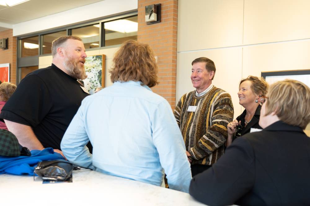 Guests conversing at the Lynn M. Blue Connection Naming Ceremony